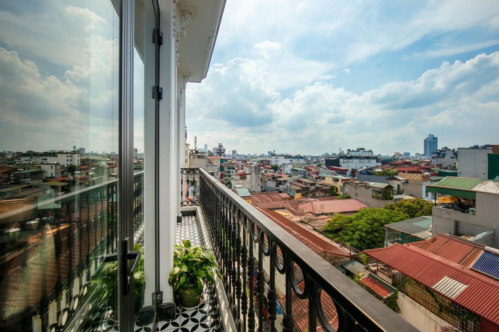 May De Ville Crown Hotel Ханой Экстерьер фото A balcony in Ho Chi Minh City, Vietnam